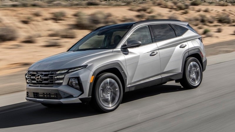 Silver Hyundai Tucson compact SUV driving on a highway